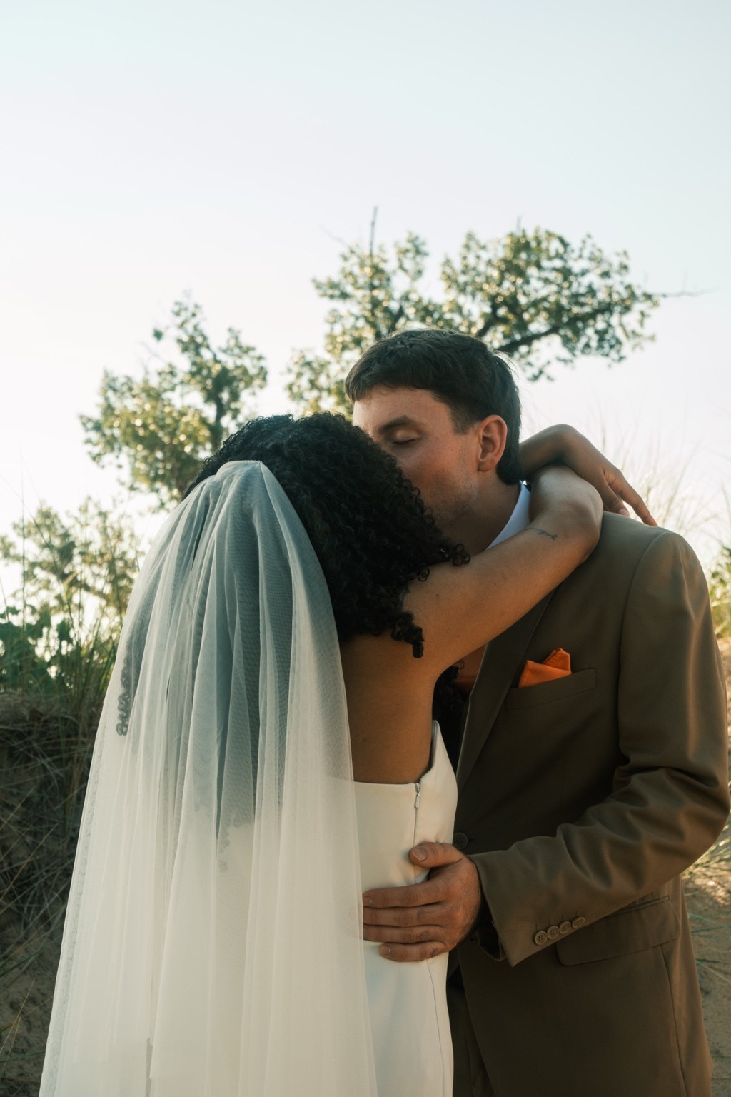 Newlyweds embracing outdoors